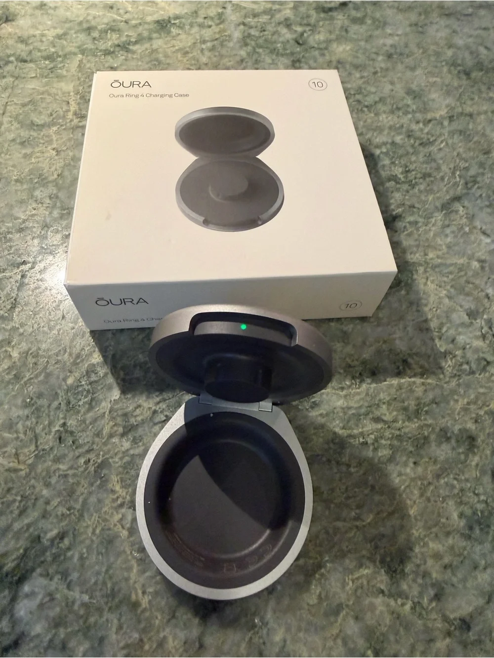 Oura Ring 4 portable charging case.